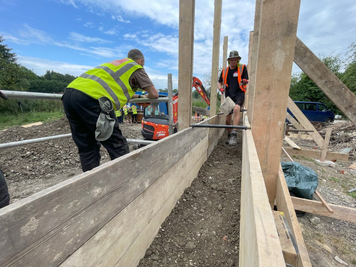 Ramming the layers of earth for the wall