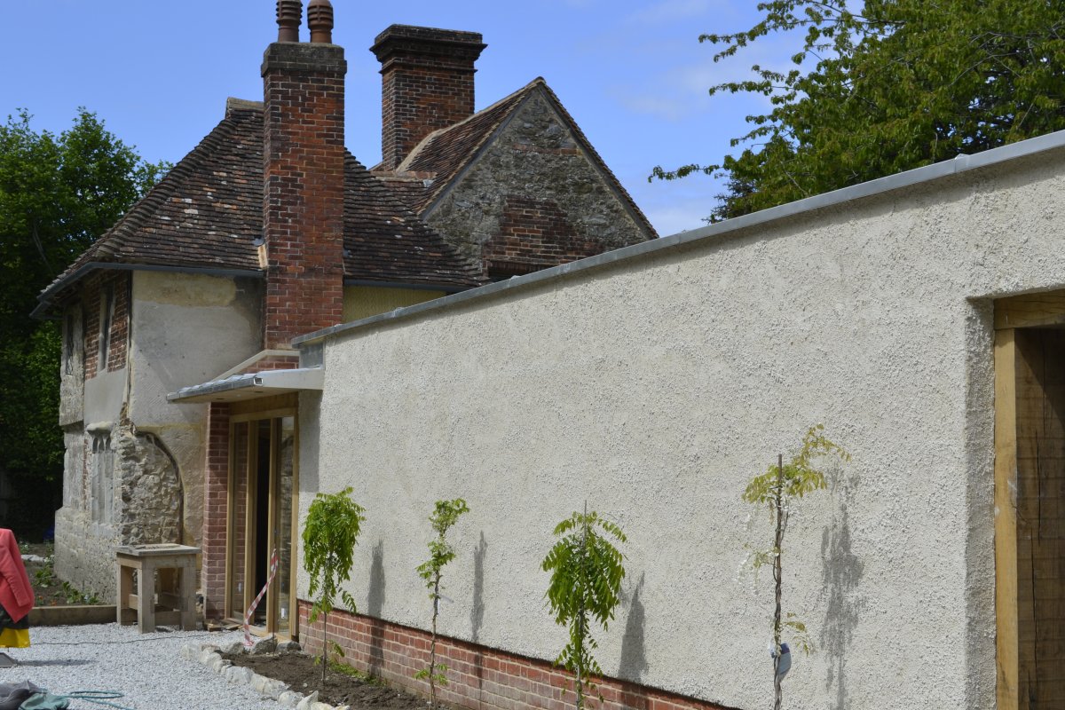 completed wall with ragstone render