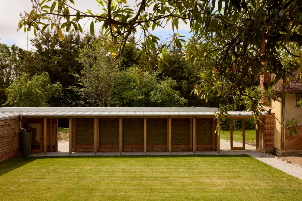 Rammed earth wall for cloistered walkway