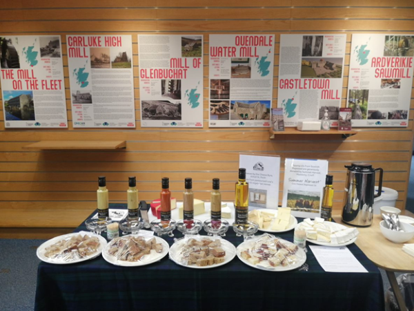 A table of refreshments in front of our exhibition of SPAB Scotland mills posters.