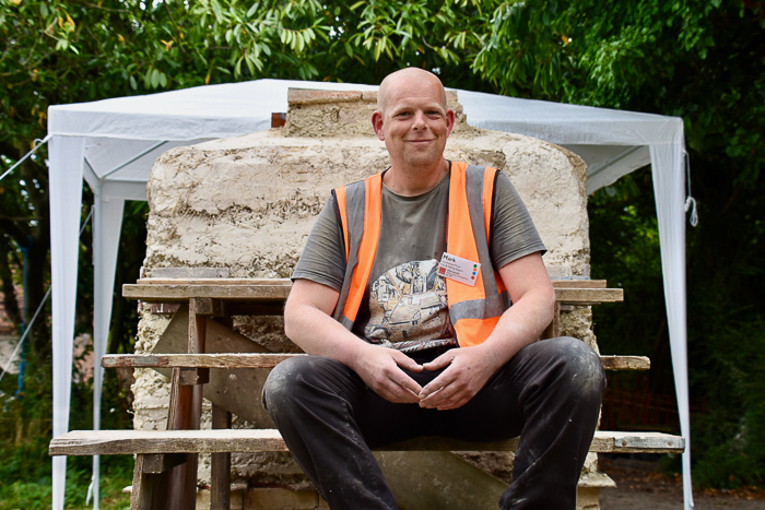 Mark Murthwaite-Price smiling in front of the lime kiln