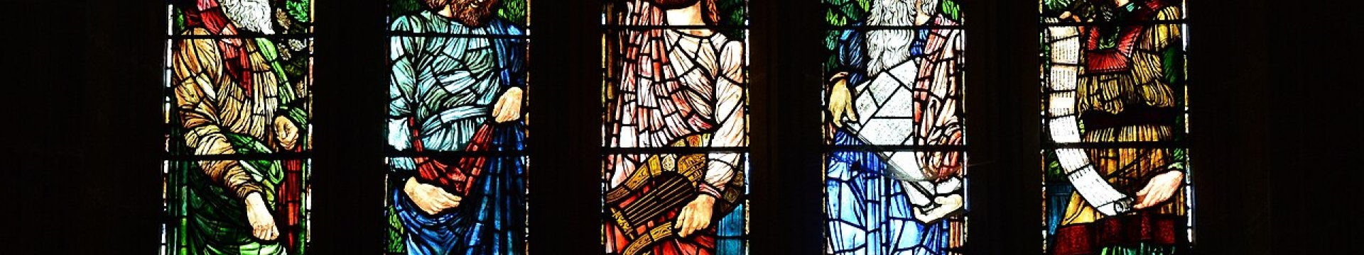 Stained glass window at All Saints Langport CC-BY-SA Via Wikimedia Commons