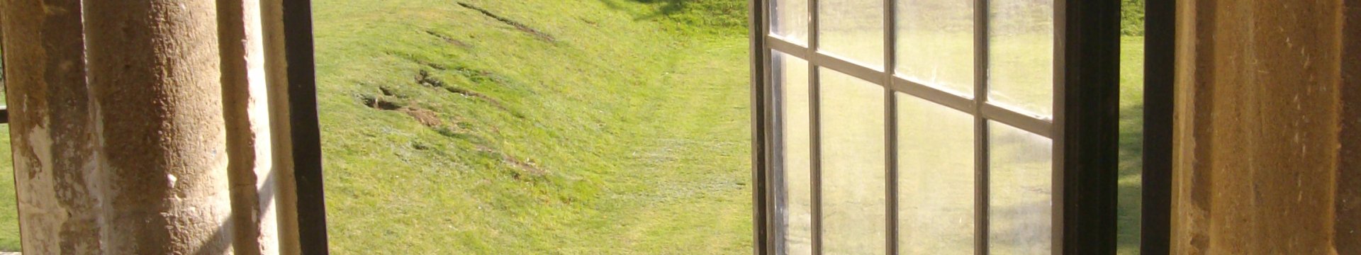 Leaded window opening to a garden