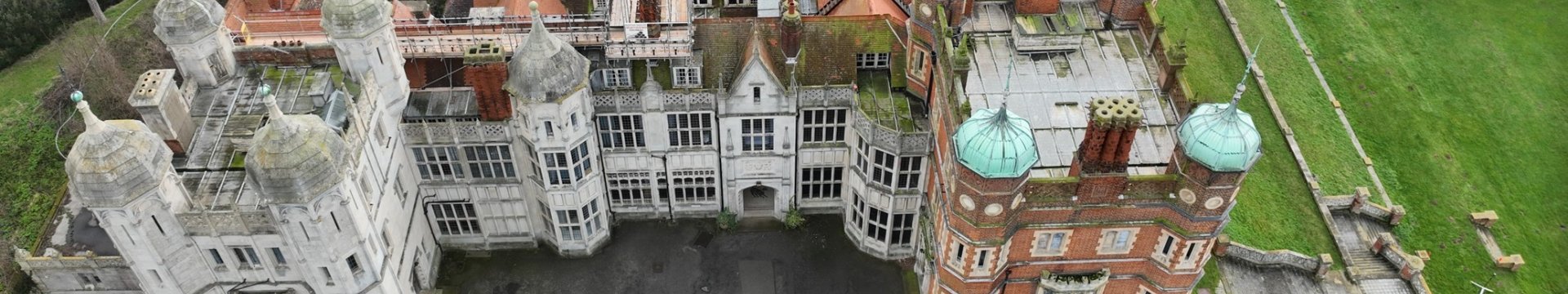 Bawdsey manor shot from a drone. A large Victorian manor house with the sea behind