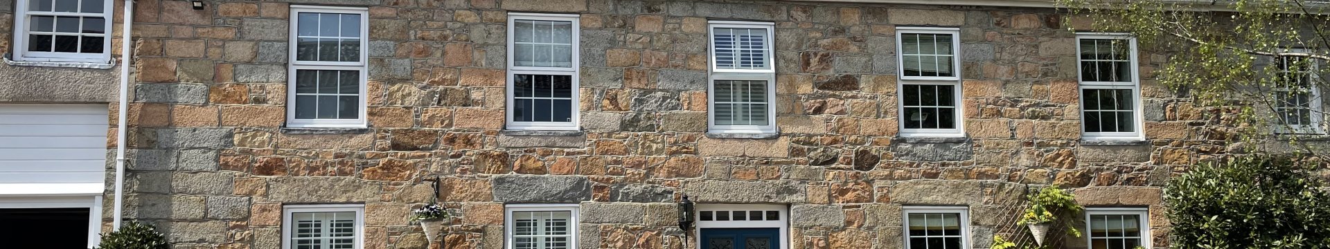 A stone house with slate roof. 