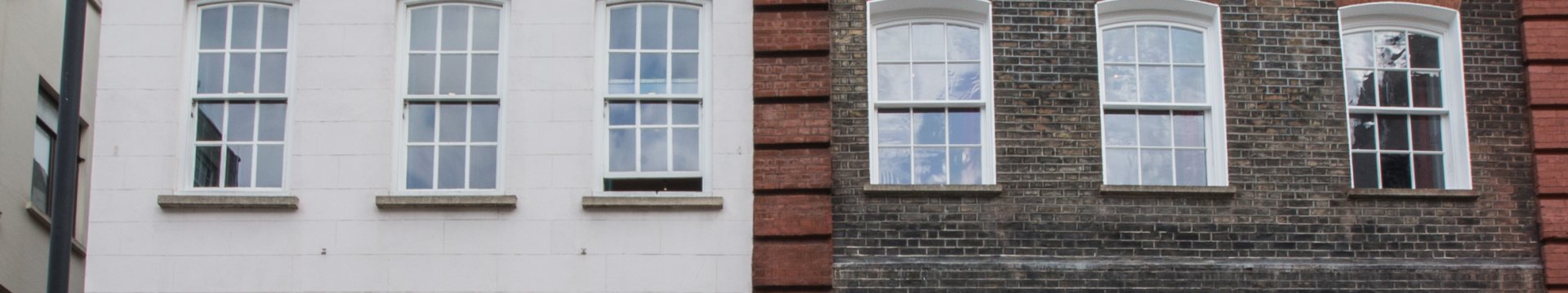 Photograph of two Georgian buildings on Brook Street, London, now Handel and Hendrix Museum.
