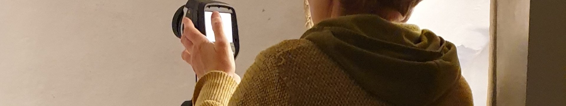 Diane Hubbard using handheld monitoring equipment