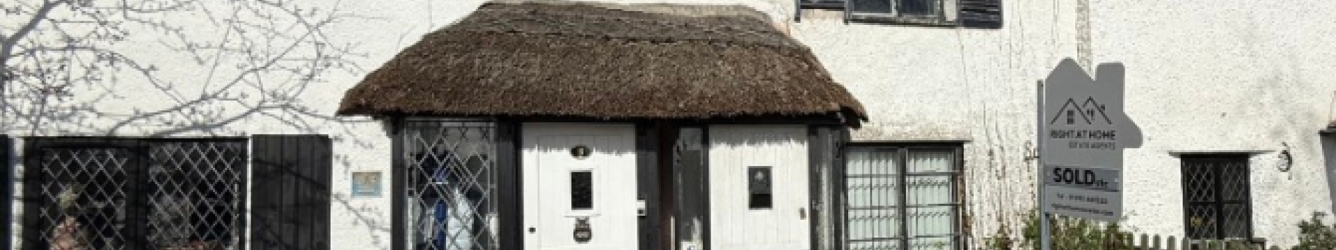 Terraced thatched cottage