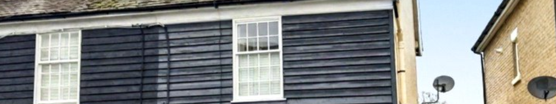 weather boarded semi detached cottage