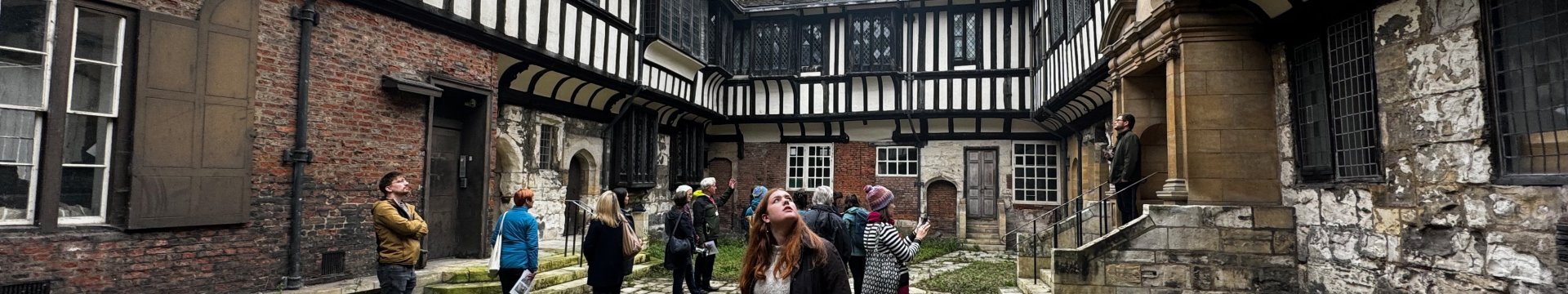People looking at an old building