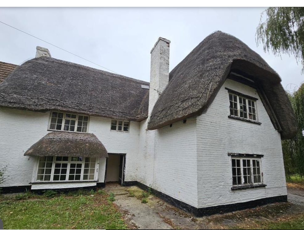 Semi-detached thatched cottage