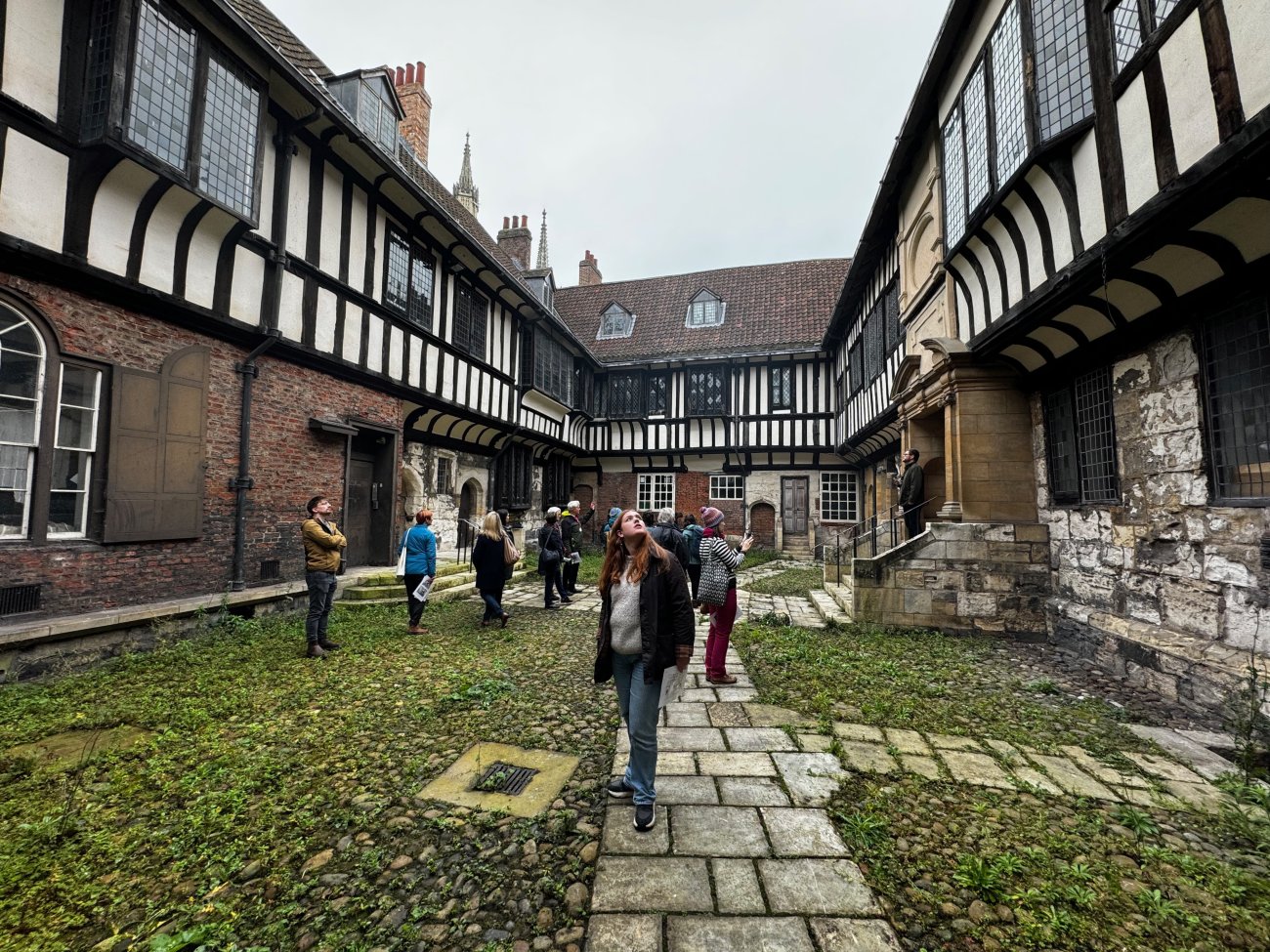 People looking at an old building