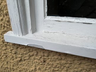 wooden window with peeling paint