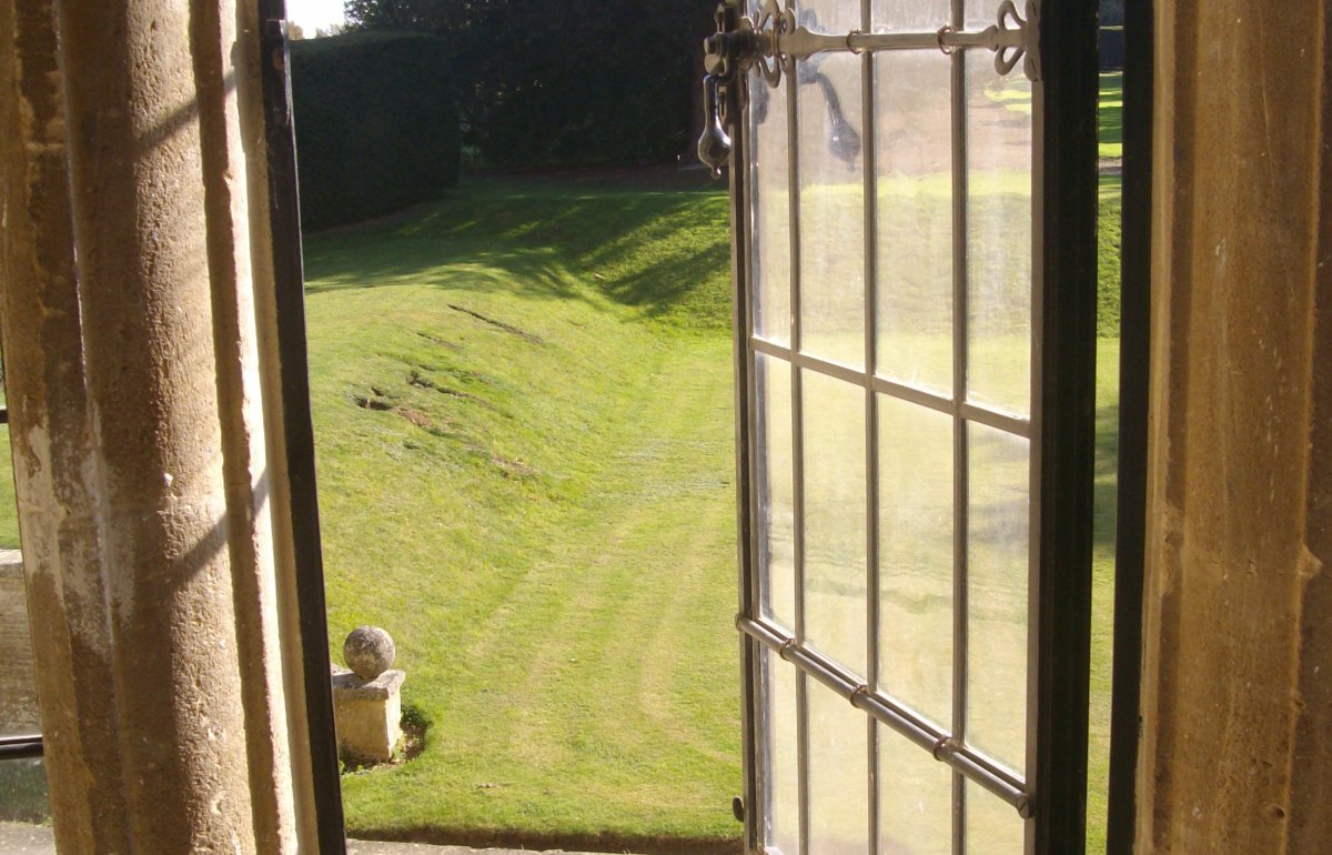 Leaded window opening to a garden