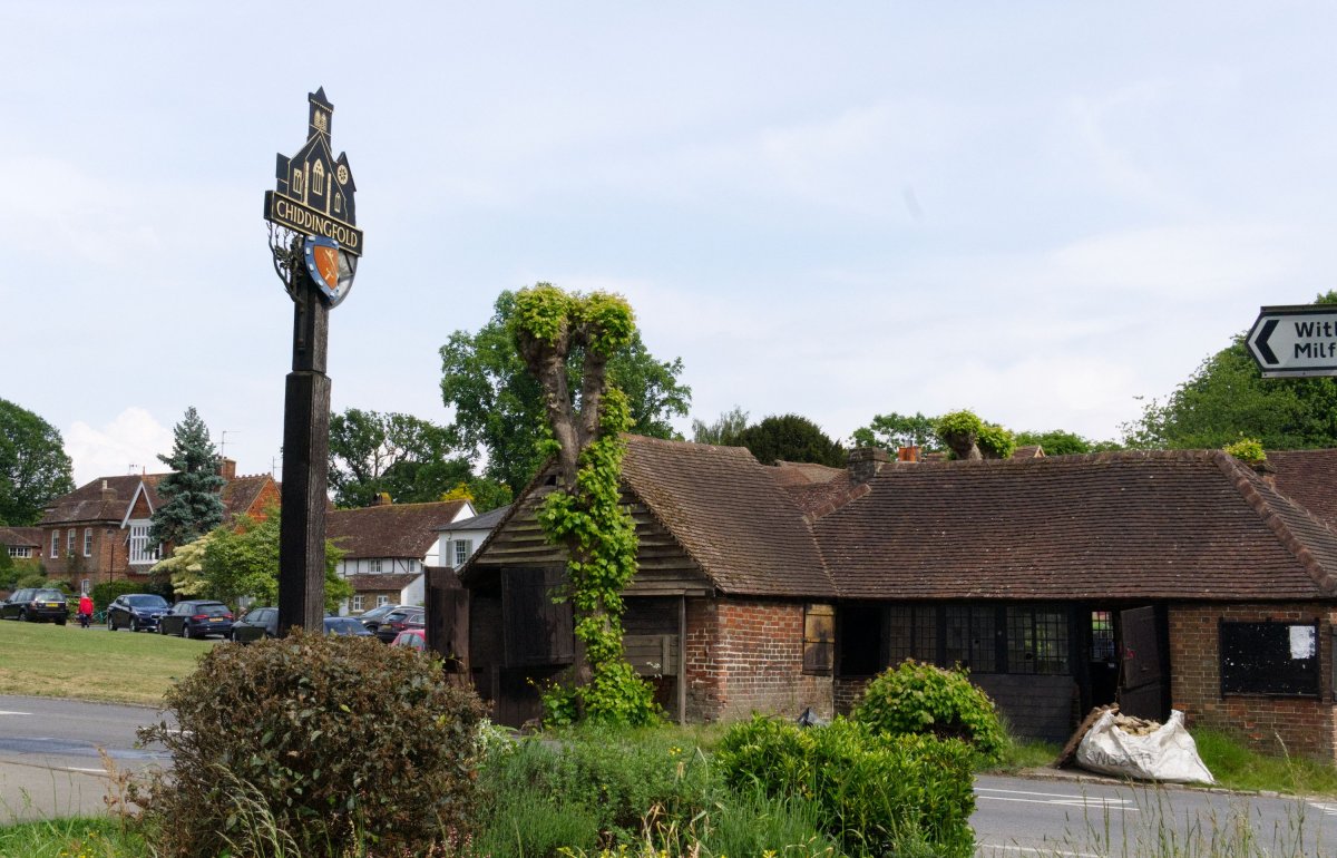 Chiddingfold forge. Old building and village sign