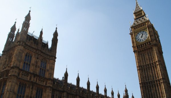 The houses of parliament against a blue sky with the clock tower.